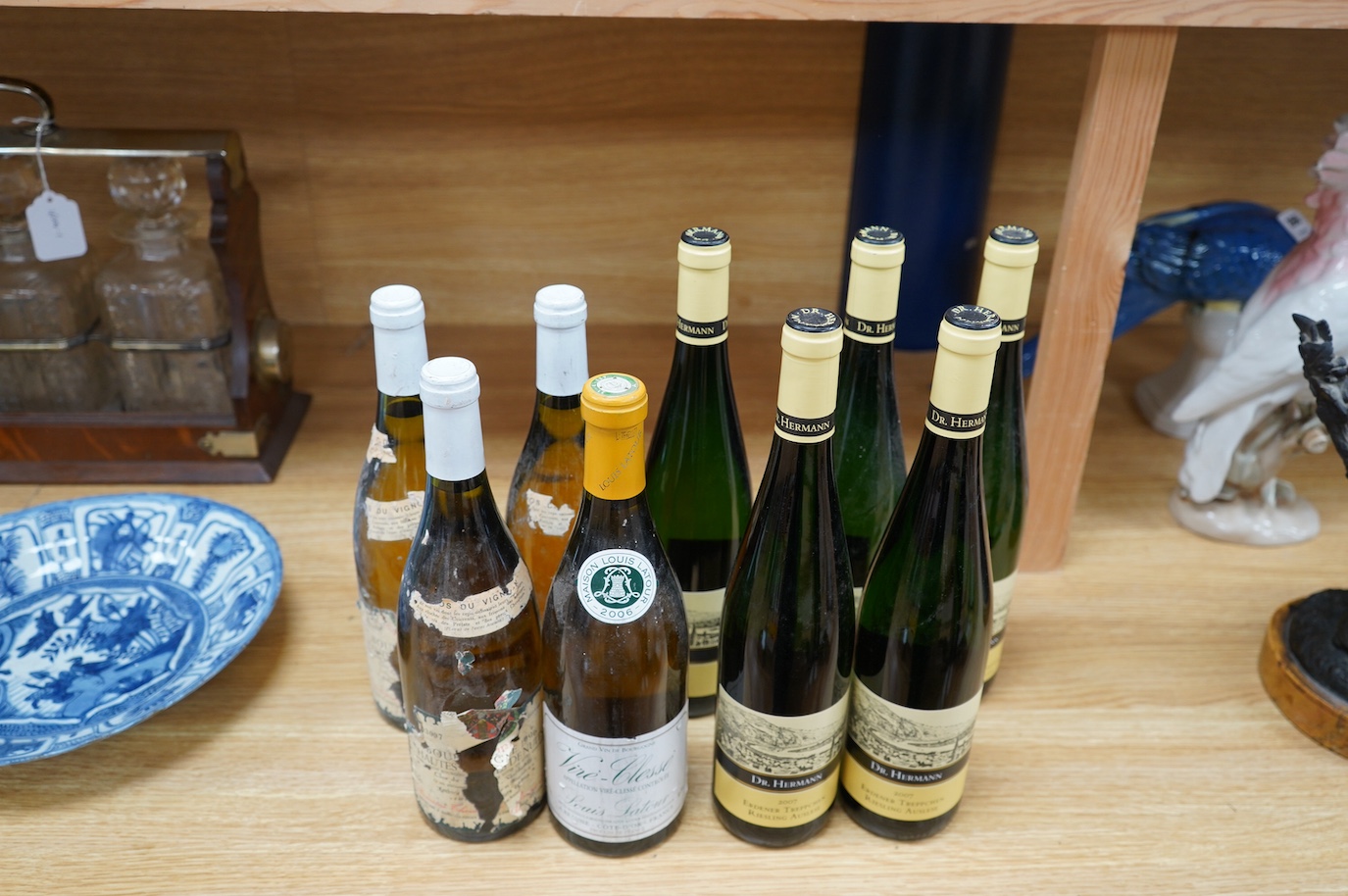 Nine bottles of white wine including; Five bottles of Dr. Hermann 2007 Erdener Treppchen Riesling Auslese, a bottle of Vire-Clesse Louis Latour, and three bottles of 1996 wine (labels badly damaged). Condition - poor to